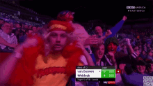 a crowd of people watching a game between van gerwen and whitlock on a bbc america channel