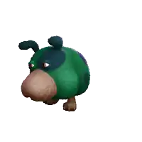 a green and blue stuffed animal with a big nose and eyes