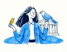 a woman in a blue jacket holds a bird in her hand