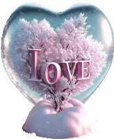 a snow globe in the shape of a heart with the word love written on it