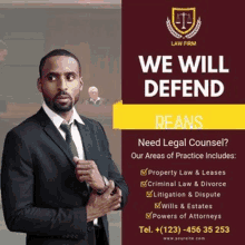 a man in a suit and tie is standing in front of a sign that says `` we will defend beans '' .