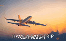 an airplane flying in the sky with the words " have a safe trip " below it