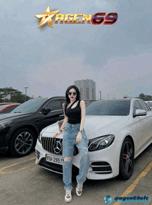 a woman stands in front of a white mercedes with a license plate that says 99a-295.54