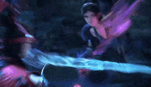 a man and a woman are fighting with a sword that is glowing blue and purple .