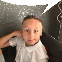 a young boy in a white shirt with a speech bubble behind him