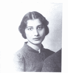 a black and white photo of a woman in a blue shirt