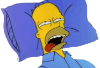 homer simpson is laying in bed with his tongue out