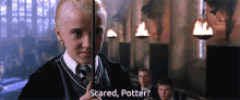 a boy holding a wand with the words scared potter written on it