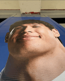 a close up of a man 's face with a very large neck