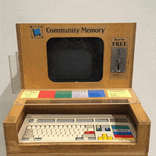 a wooden box that says community memory on the front