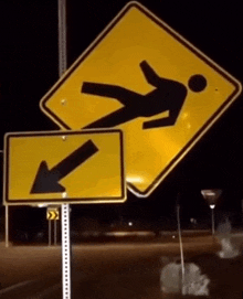 a yellow sign with an arrow pointing to the right and a man falling on it