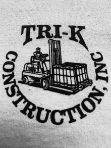 a black and white logo for trik construction