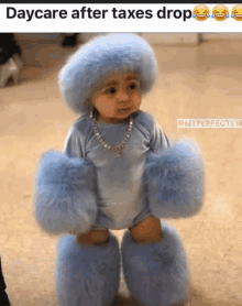 a baby is wearing a blue furry outfit and slippers .