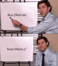 a man points to a white board that says buy zilla coin