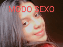 a woman 's face is shown with the words modo sexo behind her