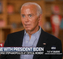 a man in a suit is being interviewed by george stephanopoulos