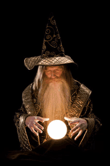 a man in a wizard costume is holding a crystal ball