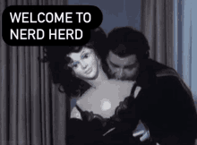 a man is kissing a mannequin with the words welcome to nerd herd above it