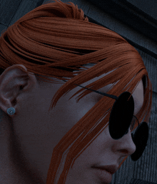 a close up of a woman 's face with sunglasses and earrings