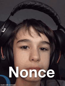 a young boy wearing headphones with the word once written on the bottom