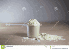 a scoop of powdered milk is on a table