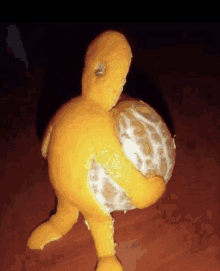 a peeled orange with a hole in it looks like a turtle