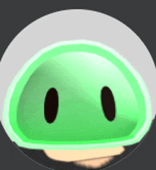 a green cartoon character with two black eyes is in a circle .