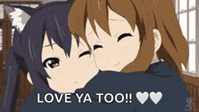 a couple of anime girls hugging each other in a room .