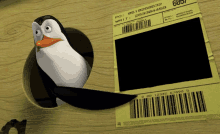 a penguin is looking out of a hole next to a postage label