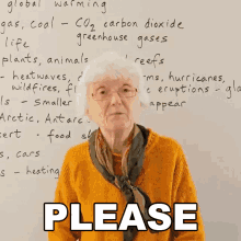 an elderly woman is standing in front of a whiteboard with the words please written on it