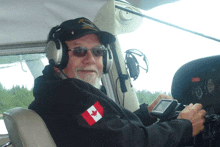 a man wearing headphones and a hat that says eagle valley