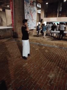 a man stands in front of a sign that says " design "