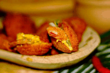 a close up of fried food with a bite taken out of it