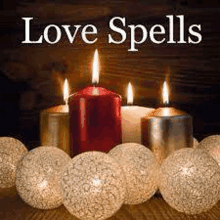 a group of candles sitting on top of a wooden table next to cotton balls .