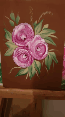 a painting of three pink roses with green leaves