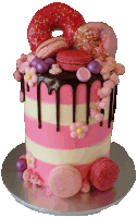 a pink and white striped cake with a donut on top