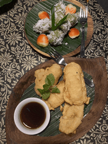 a plate of food with a dipping sauce on the side