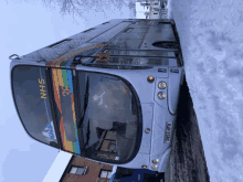 a double decker bus with nhs on the side