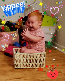 a baby is sitting in a basket with the words yippee on the top