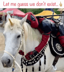 a person in a deadpool costume is riding a horse