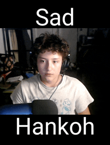 a picture of a boy with headphones and the words sad hankoh