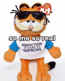 a stuffed garfield wearing sunglasses and a t-shirt that says " perfection is hard to improve "