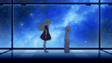 two girls are standing in front of a window with a starry sky behind them