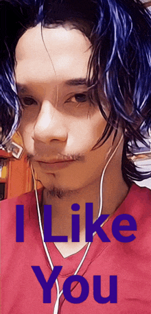 a man with blue hair is wearing ear buds and a red shirt that says " i like you "