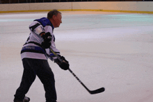 a hockey player with the word tribute on his shirt