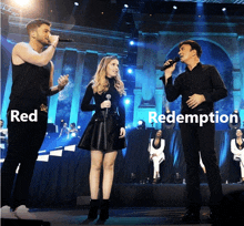 two men and a woman singing on a stage with the words red redemption in the corner