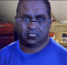 a man wearing glasses and a blue shirt