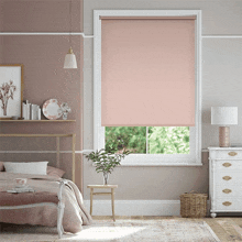 a bedroom with pink walls and a pink blind