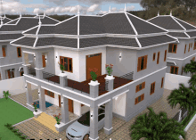 a car is parked in front of a house with a balcony