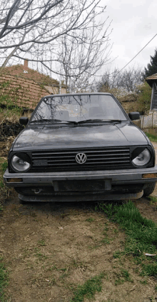 a volkswagen car is parked in a grassy area